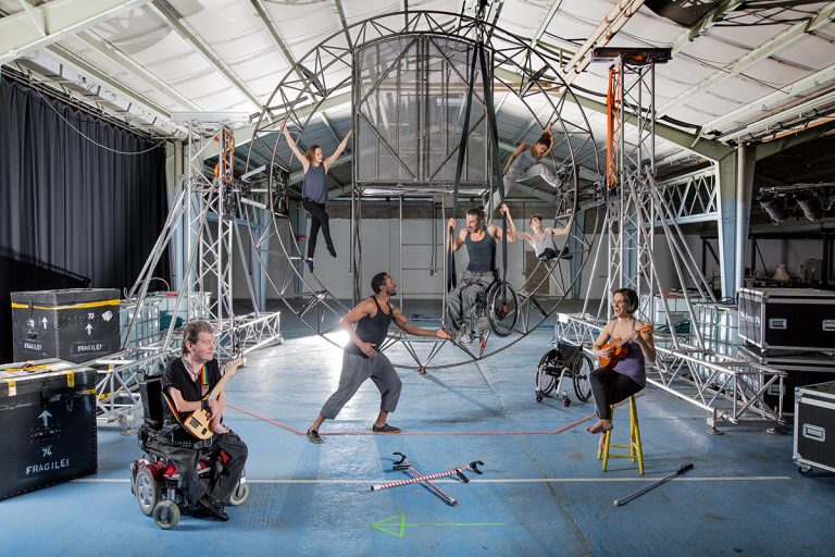 Seven extraordinary cast members, sit upon and around the new circular metal set for new show 'What Am I Worth?'